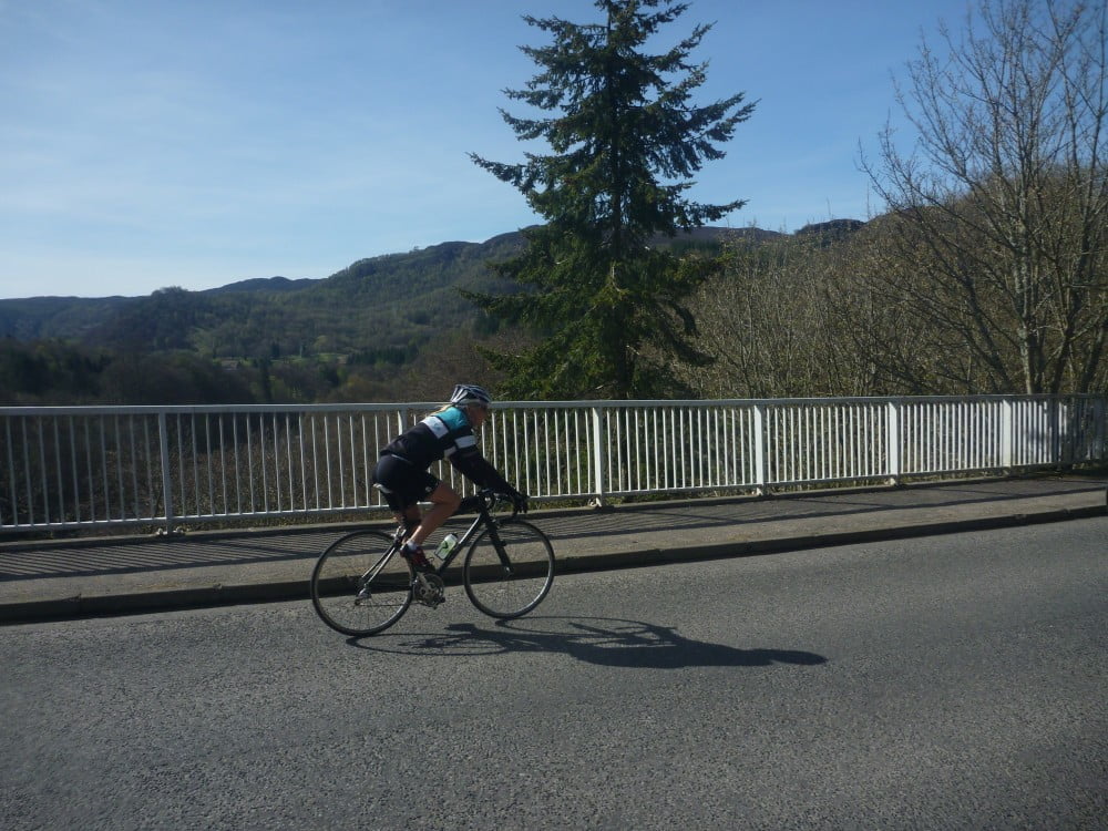 Cyclist riding over Garry Bridge on the Etape Caledonia route