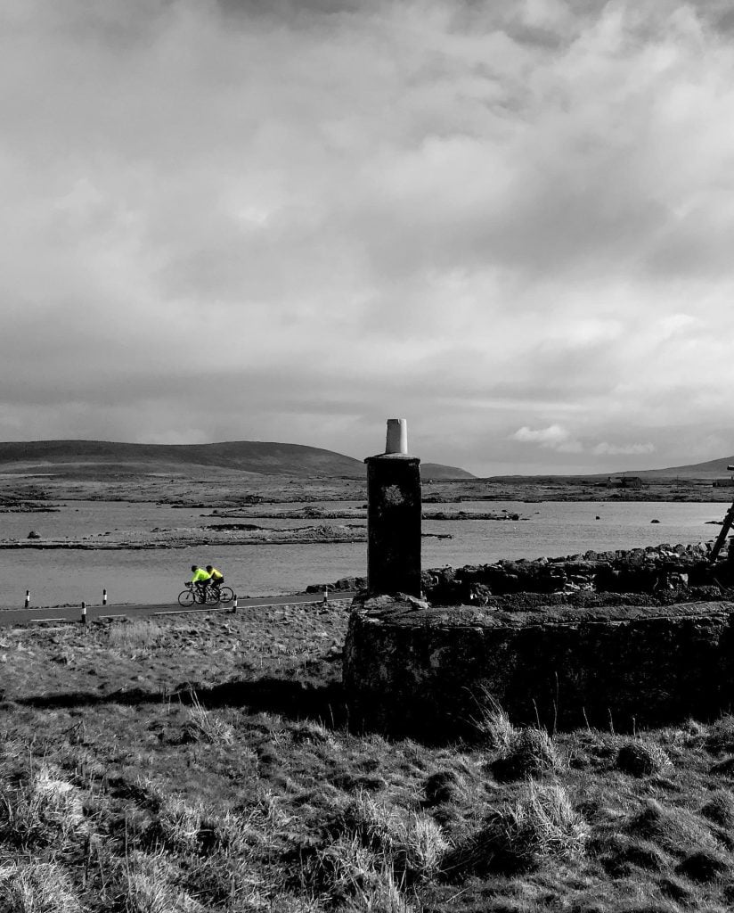 Cycling past an old ruined blackhouse on the Island of North Uist
The Hebridean Way - Cycling from Barra to the Butt of Lewis