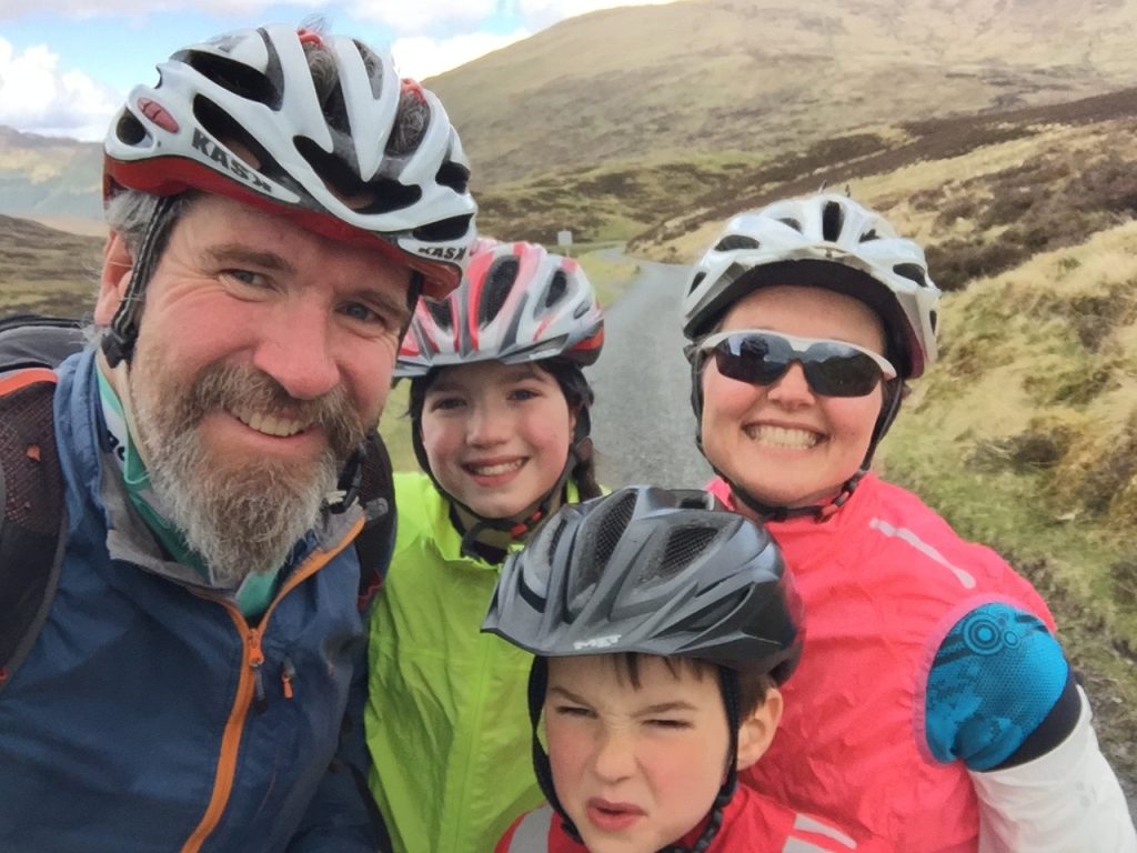Family road cycling group shot on Ben Lawers