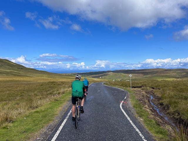 Cyclists riding on a single track road on the Outer hebrides