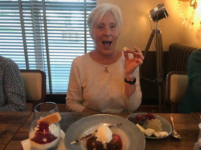 A cyclist enjoys dinner after a day of riding on the Hebridean Way