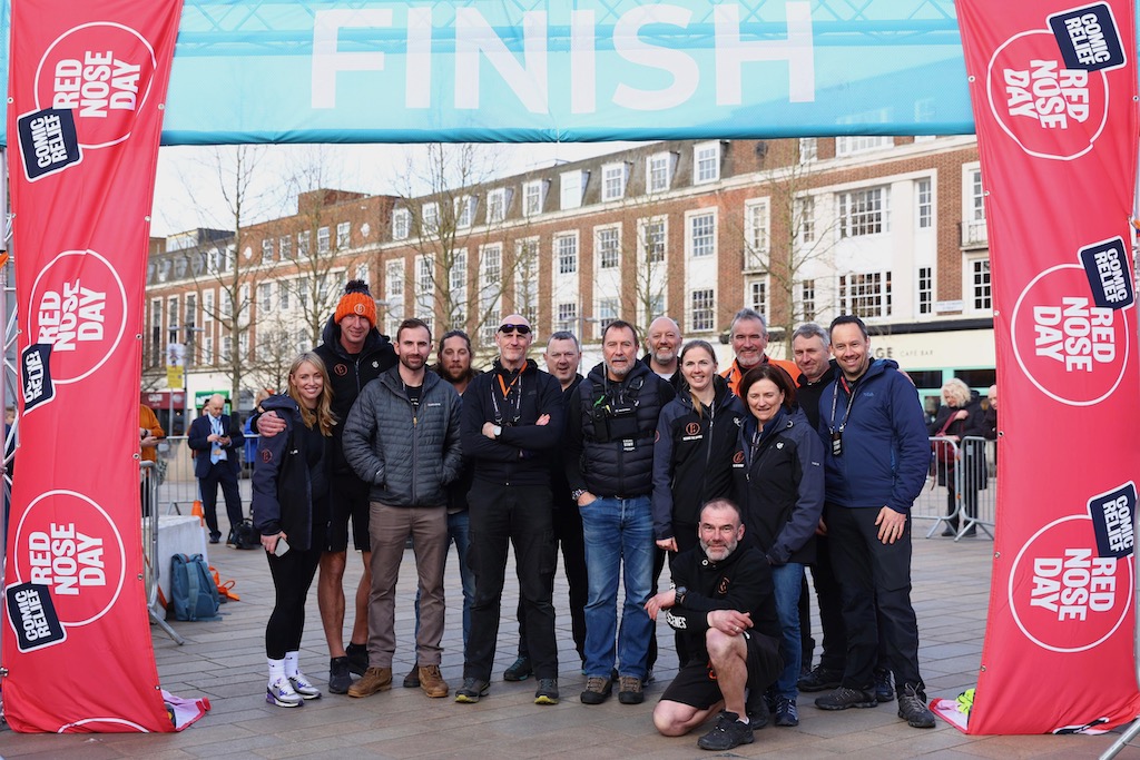 The support team from Behind the Scenes at the finish line of Mollie King Pedal Power Challenge for BBC Comic Relief and Red Nose Day