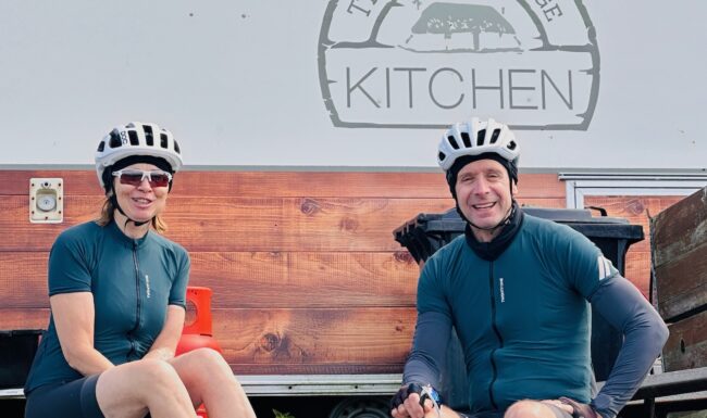Two cyclists riding on the hebridean way cycling holiday in scotland stop for some food at the Wee Cottage Kitchen on North Uist.