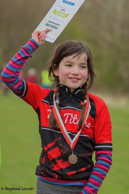 Bicycle race - A young girl gets her medal after winning a cross country mountain bnike race in Scotland