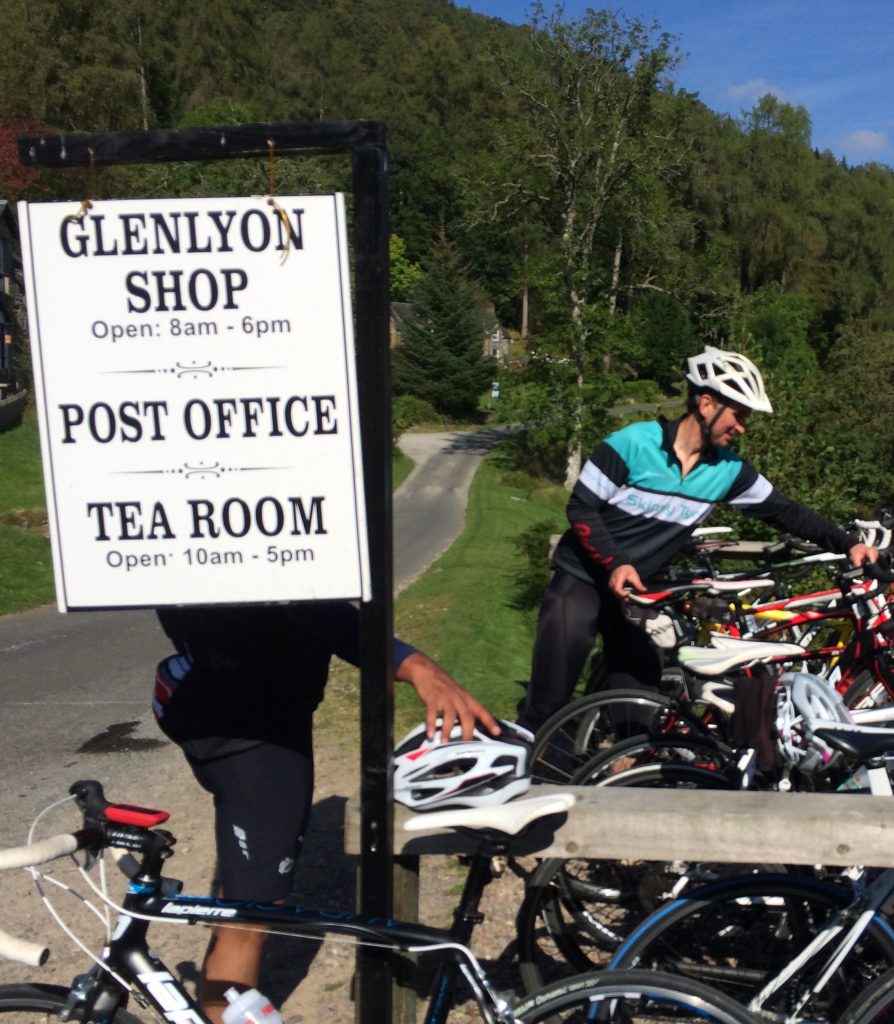 A cyclist at Glen Lyon tea room and post office
