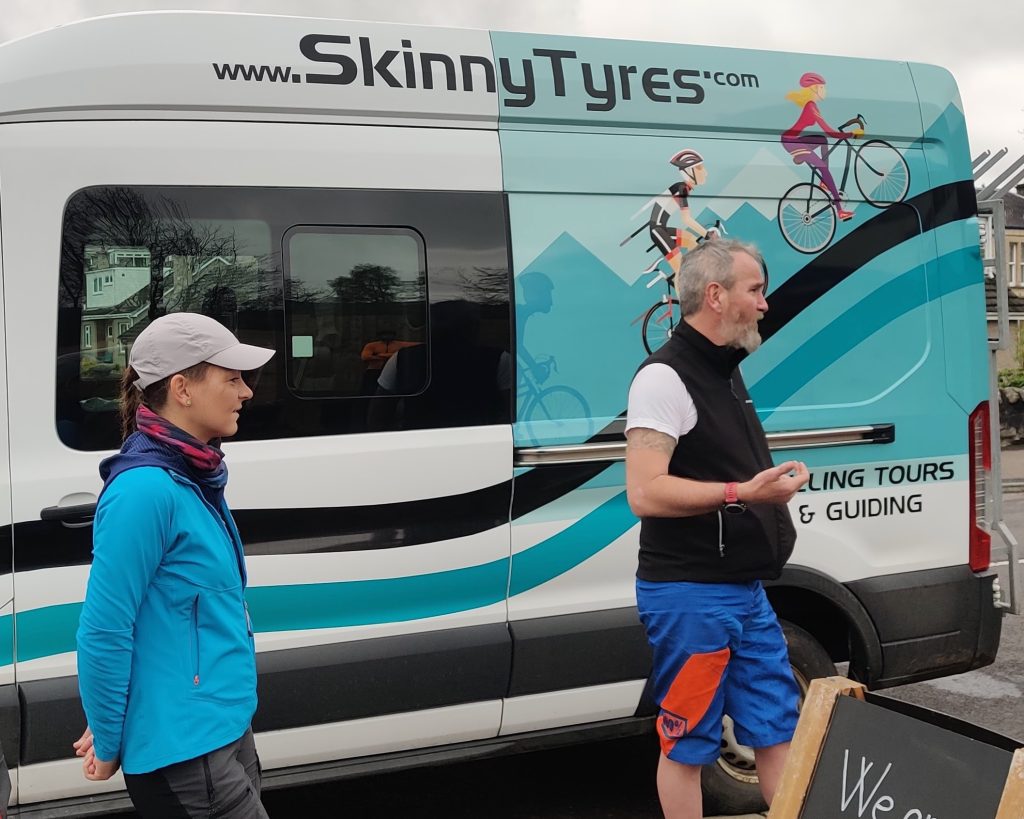 Cycling Guide Scot Tares talks to a group of cyclists