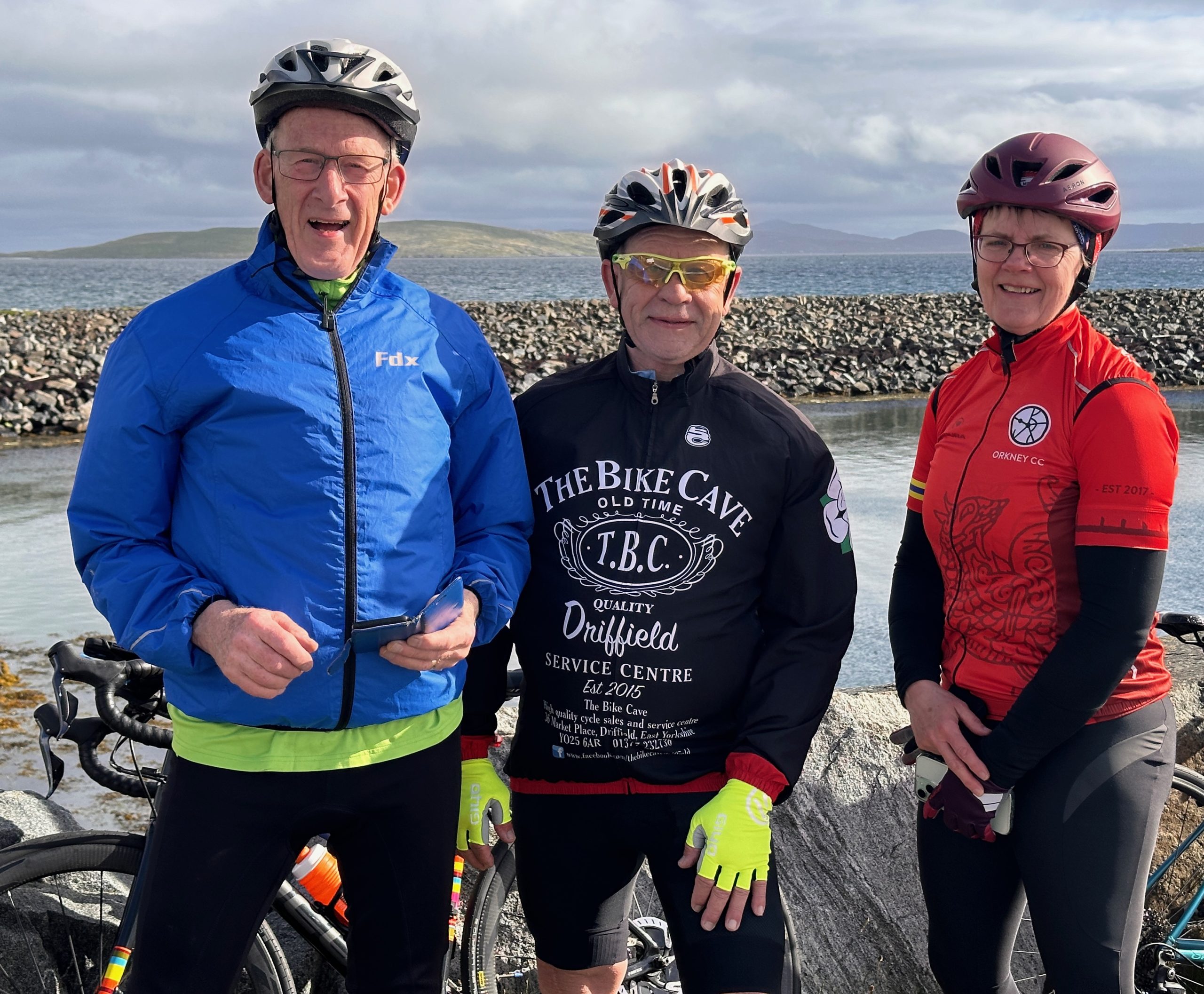 Three cyclists pose for a photo on the Hebridean Way